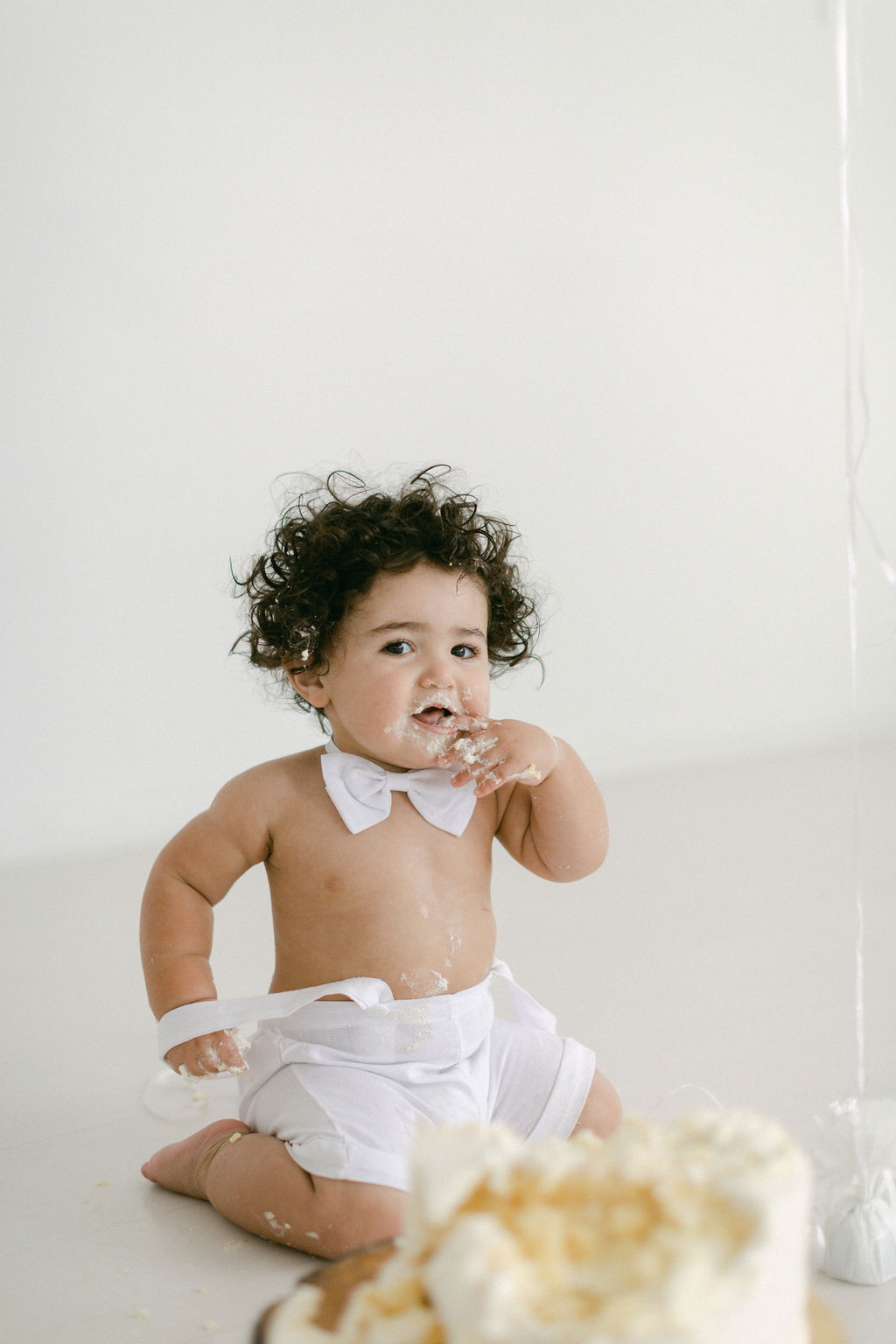 cute baby in bow tie for first birthday